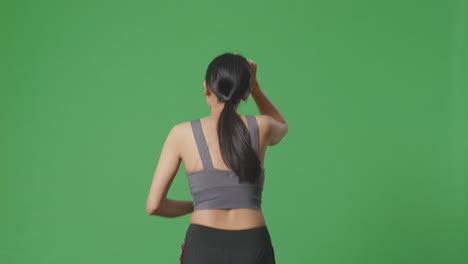 woman running on green screen