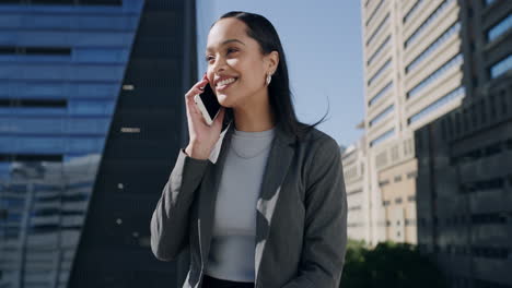 businesswoman talking on phone in city