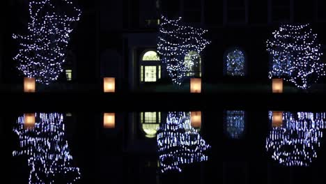 christmas night illuminations mirroring in elon university fountain