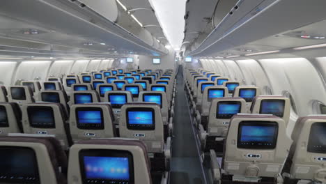 jet airplane interior view economy class monitors on seats