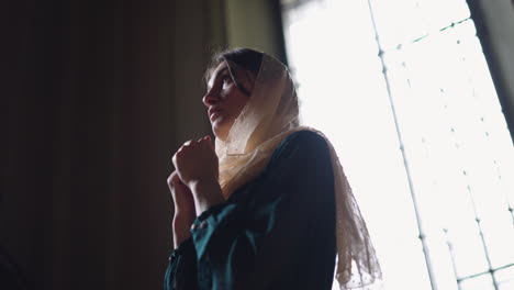 woman praying at the church