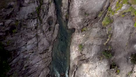 aerial top down view over behana gorge surrounded by lush trees