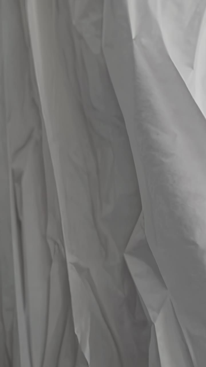 Close-up shot of crumpled gray paper, creating an abstract texture