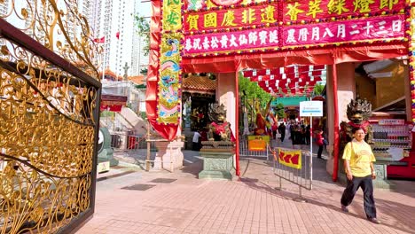 visitors enter a decorated temple entrance