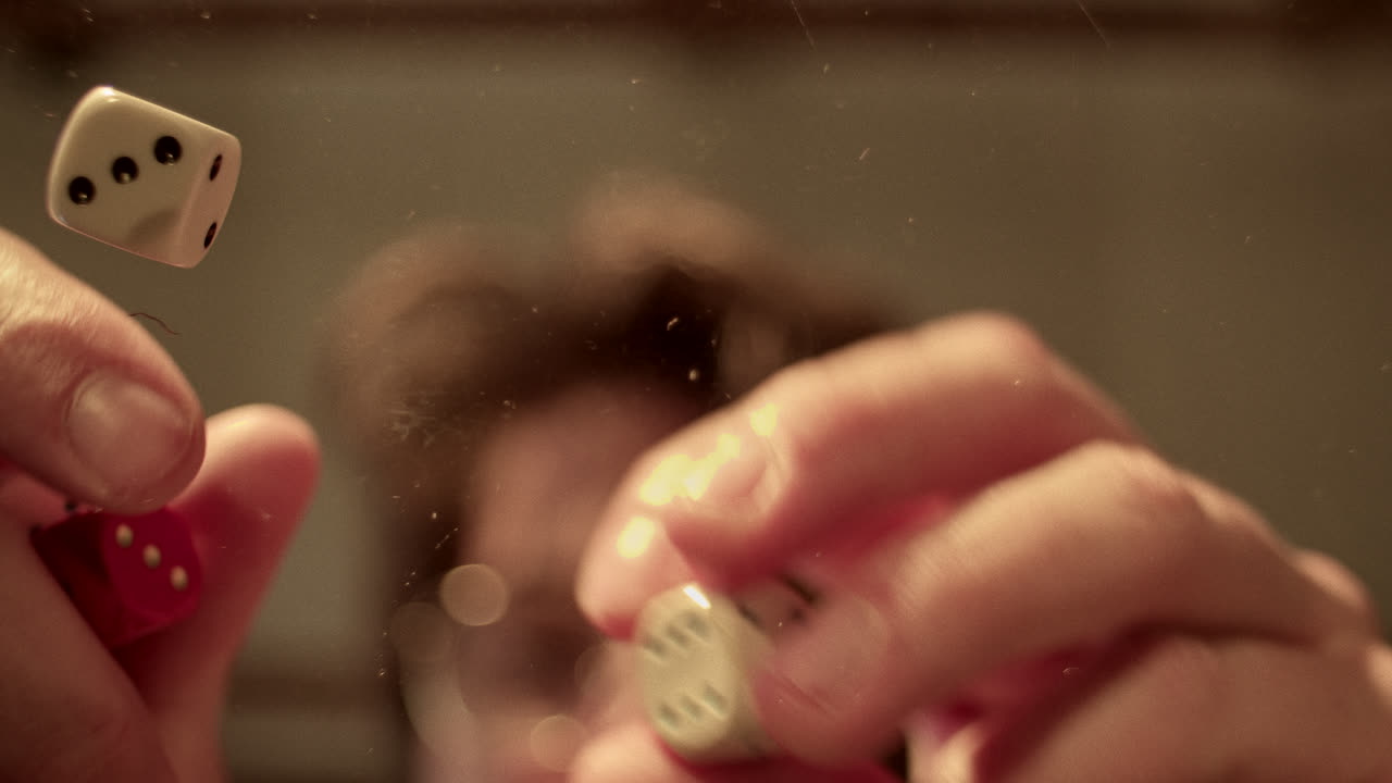 Dice Falling on a Transparent Surface from an Underside View