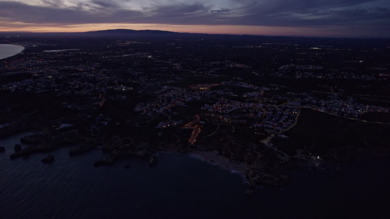 Albufeira's stunning sunset with ocean waves in Portugal