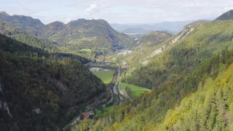 river along valley with charming houses