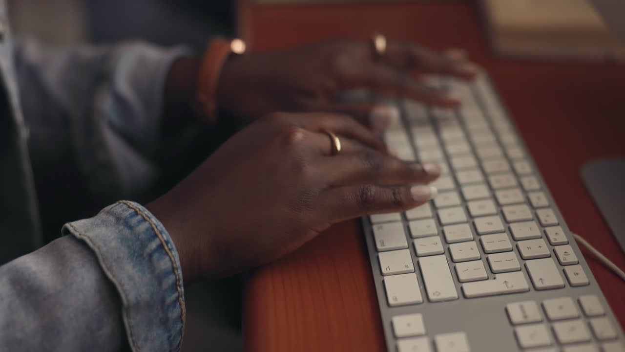 Woman Typing on a Computer Keyboard