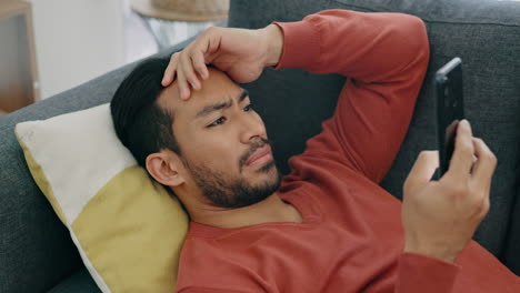 stress, depression and man with phone on couch
