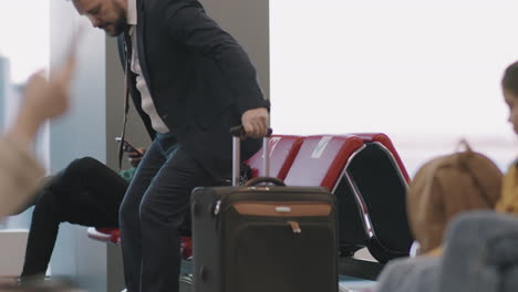Businessman Arriving At Departure Lounge