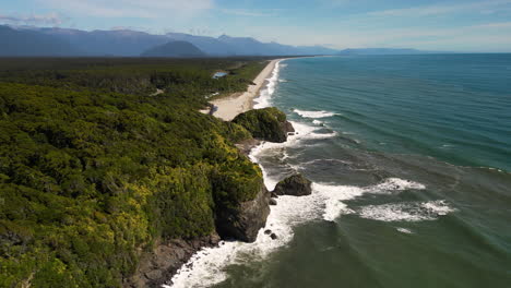 aerial along the coastline near knights point lookout , south island, new zealand