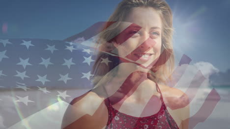 smiling woman at beach with american flag animation in background