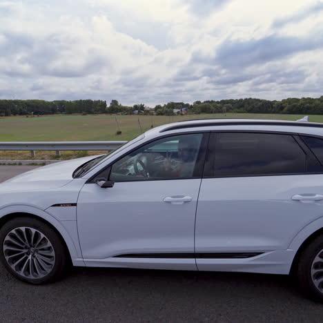 vinnitsa, ukraine - september 2019: presentation of a white audi e-tron, compact luxury crossover suv. modern new cars for sale