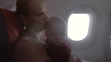 mum with baby daughter traveling by air