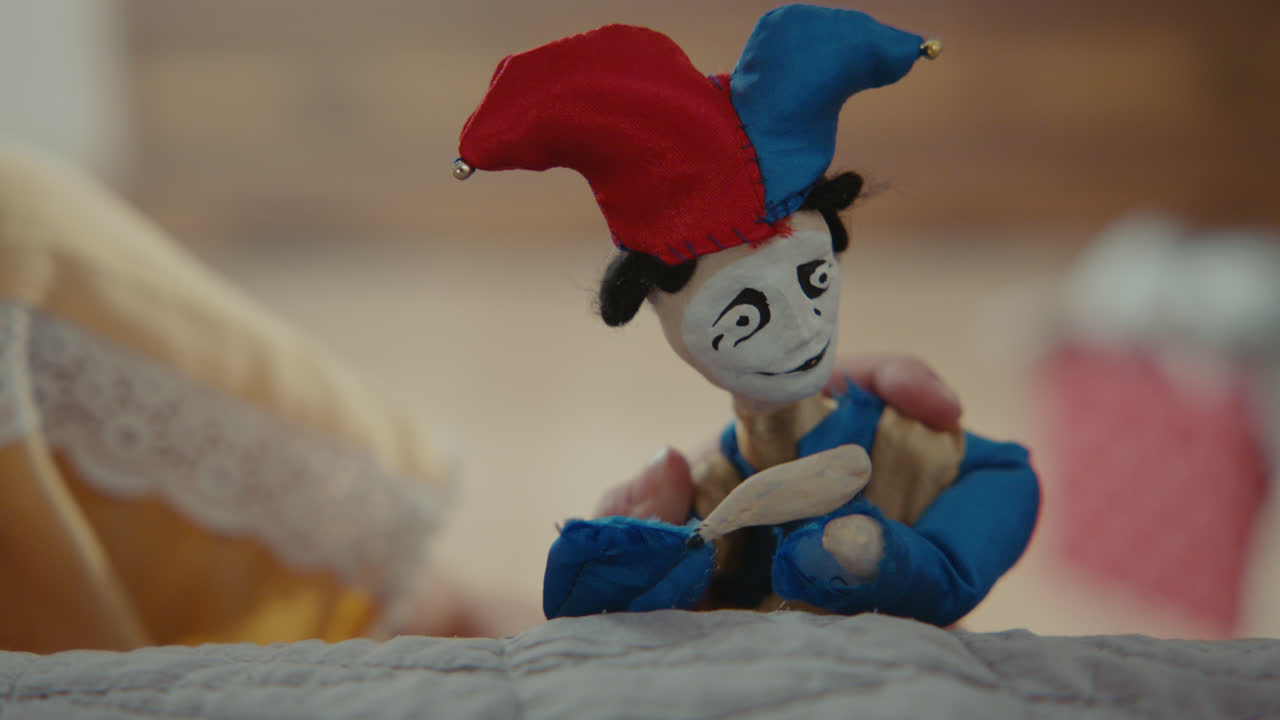 A girl playing with dolls in her room