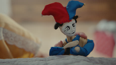a girl playing with dolls in her room