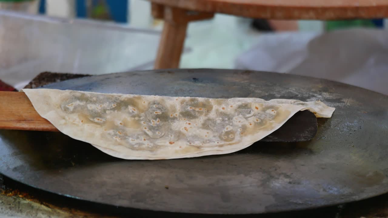 Cooking flatbread on a hot plate