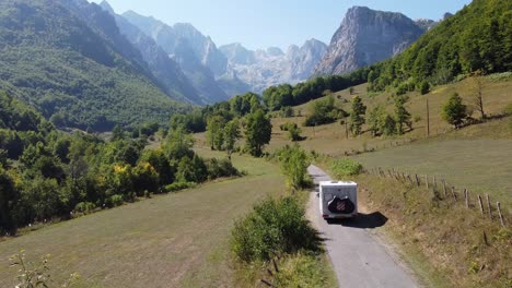 motorhome driving to prokletije national park, montenegro - drone aerial dolly