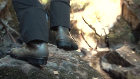 hiking through a rocky waterfall stream