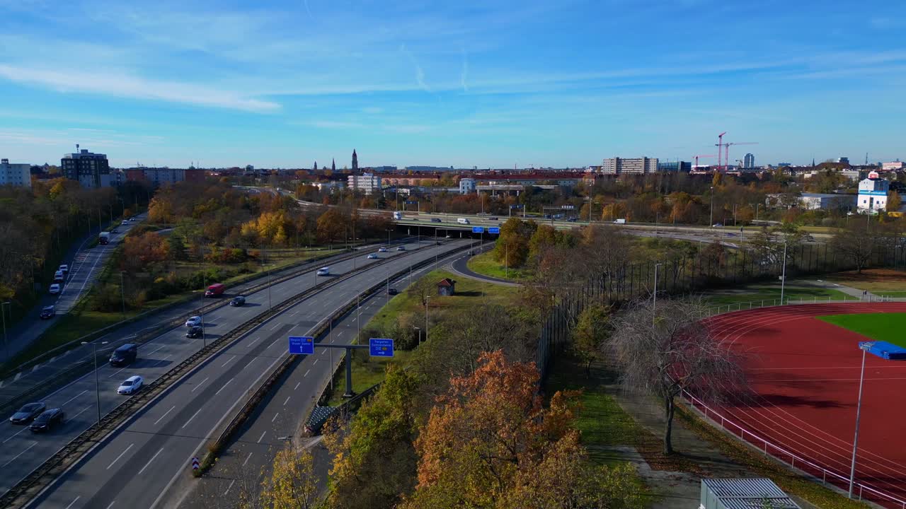 Aerial view tracking over the vast urban landscape of Berlin under a clear sky. Amazing aerial view flight descending drone