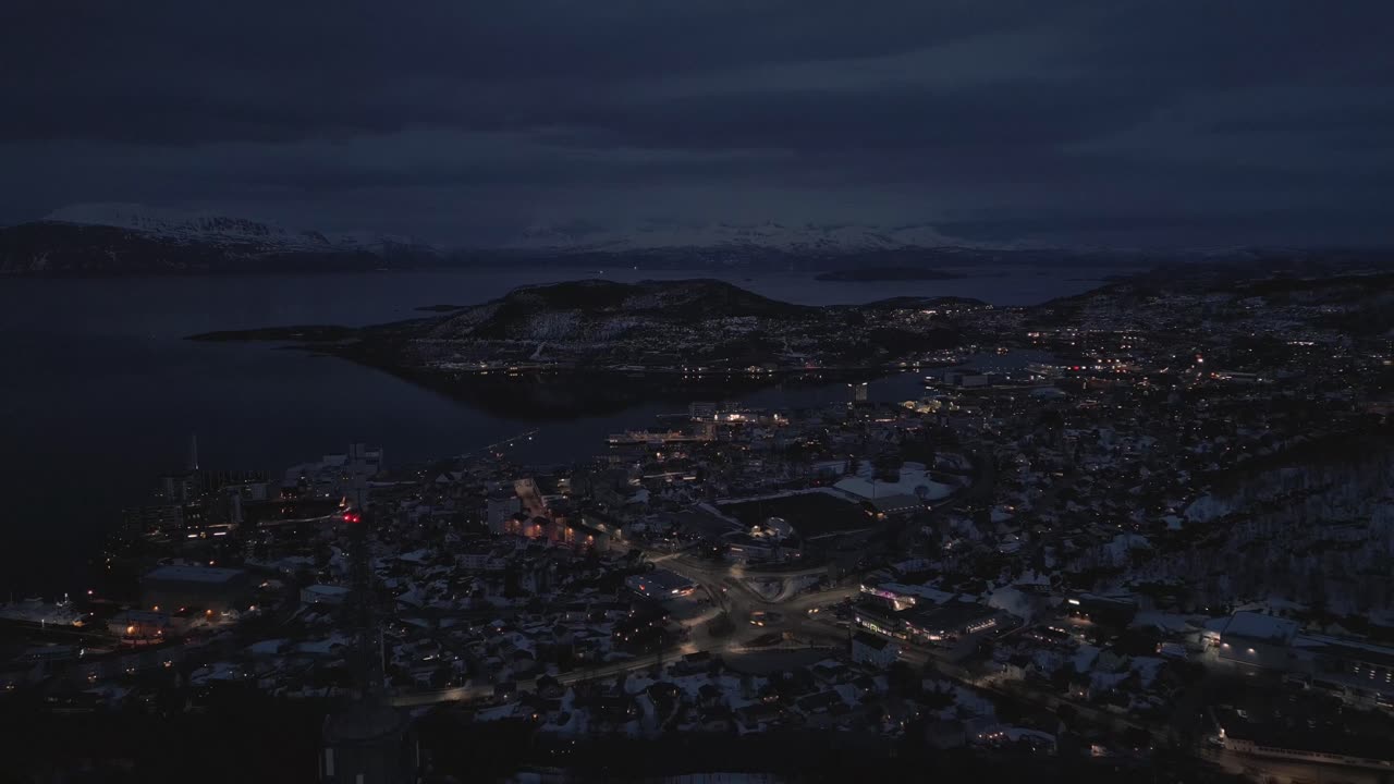 Coastal city during the evening hours, slow traffic and bright street lights