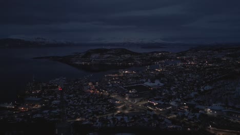 coastal city during the evening hours, slow traffic and bright street lights