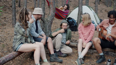 friends camping and enjoying time together in the forest
