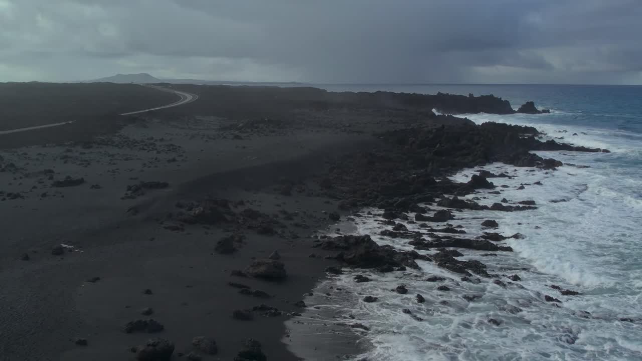 Aerial drone view of mountain sea and volcanoes in Lanzarote, Canary Islands, Spain