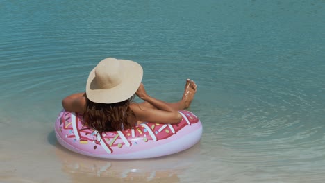 woman in the sea on a rubber ring
