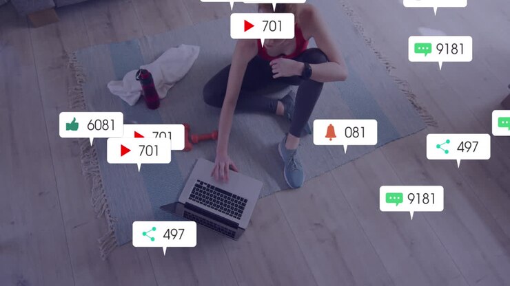 Animation of social media icons with numbers over caucasian woman using laptop