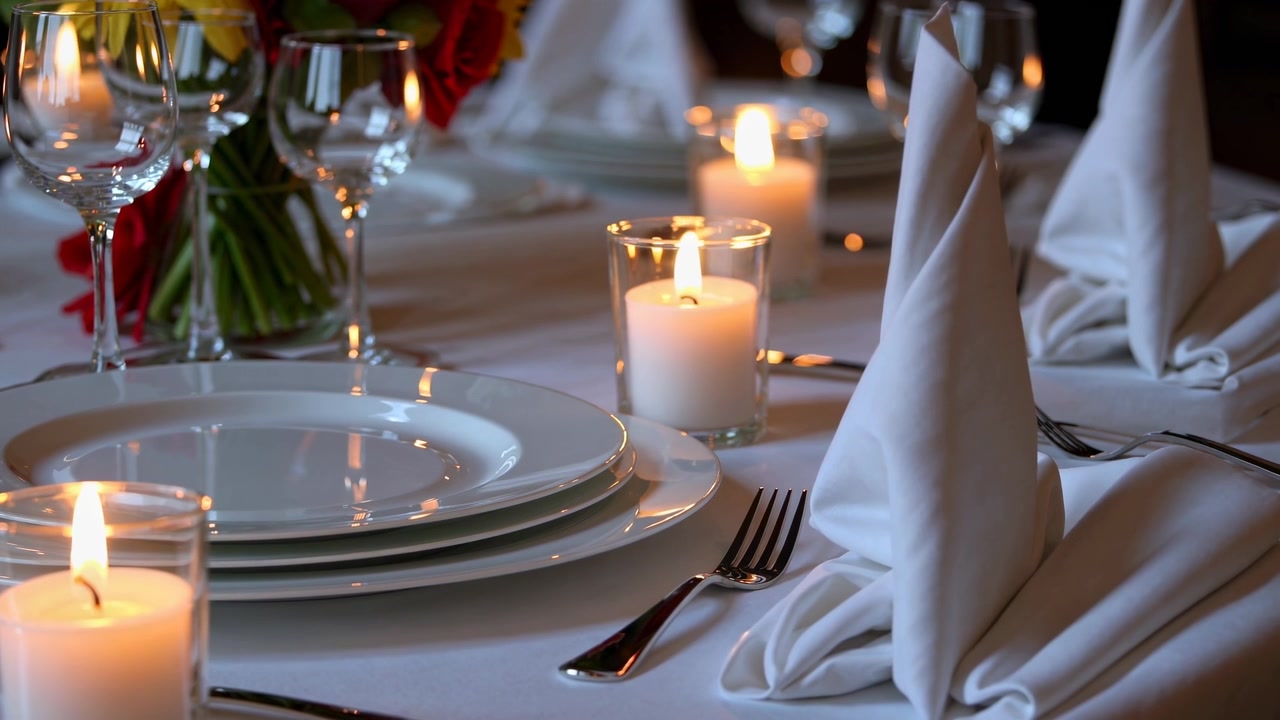 Elegant Table Setting with Lit Candles for Fine Dining