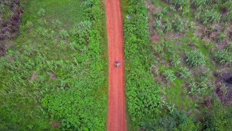 Motorcycle On A Dirt Road In Mukono, Uganda - Aerial Top Down