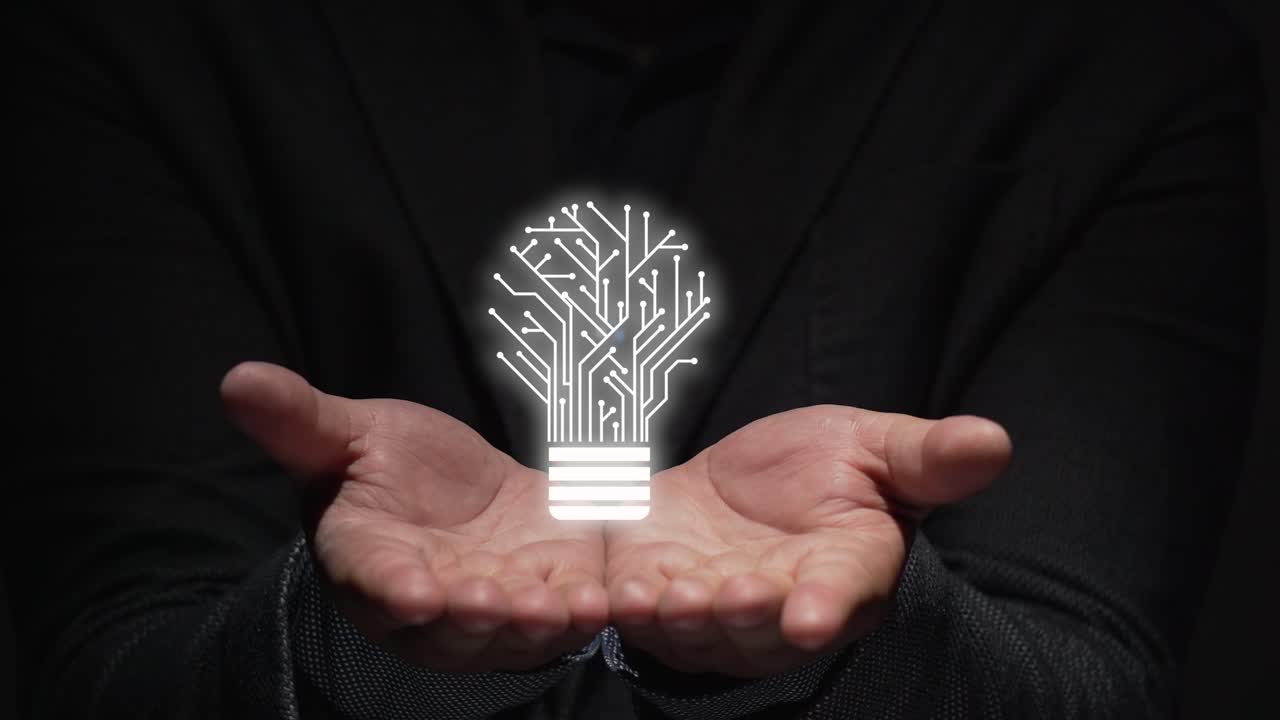 idea concept. hands teach augmented reality projection of a light bulb.