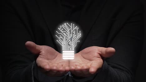 idea concept. hands teach augmented reality projection of a light bulb.