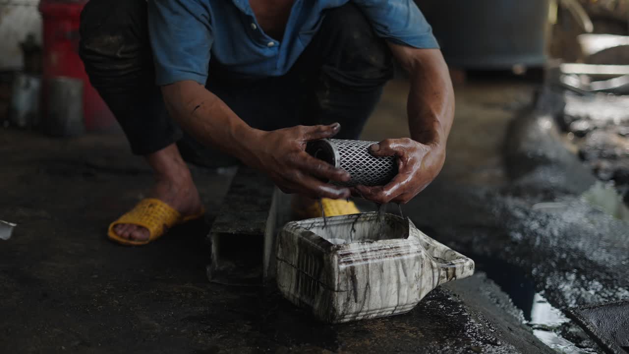 Mechanic changing oil filter