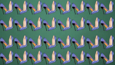 Animation-of-blue-high-heels-repeated-on-green-backgroud