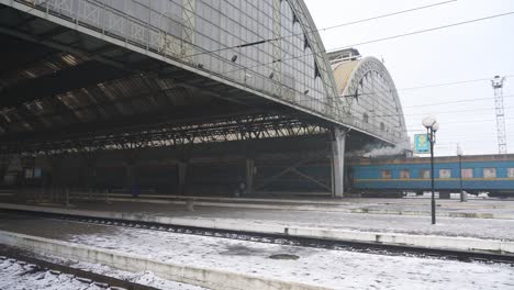 view of train station in kyiv, ukraine on a winter day - panning shot