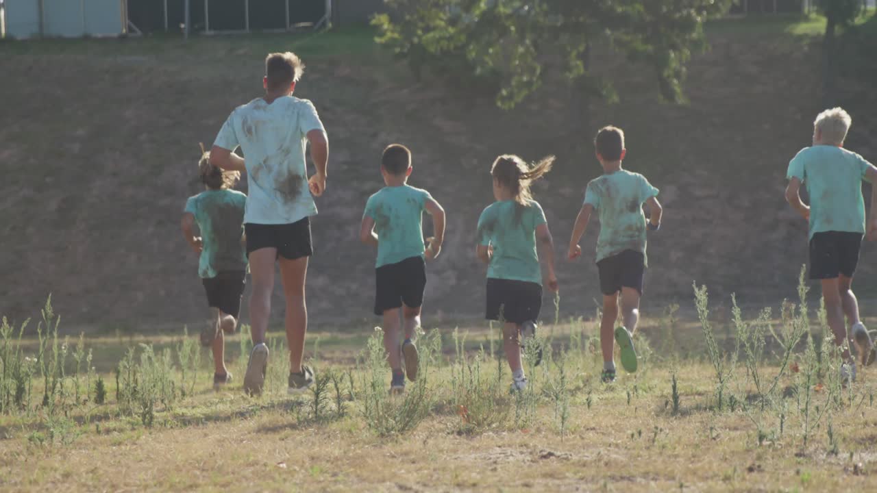 Group of Caucasian children training at boot camp
