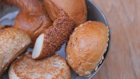 closeup of a variety of bread rolls in a bowl