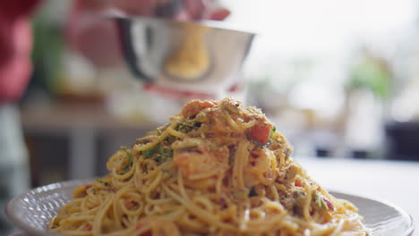 adding seasonings to pasta