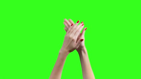 video de manos femeninas aplaudiendo sobre un fondo verde