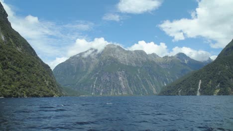 cruise ship in new zealand milford sound fiordland national park. a boat tour with an amazing view of the fjord in the legendary travel destination in new zealand.