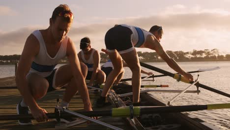Male rower team preparing for training