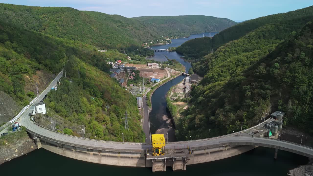 Gorgeous drone view from the Tarnița hydraulic power plant and surrounding landscape and Someșul Cald river in Romania