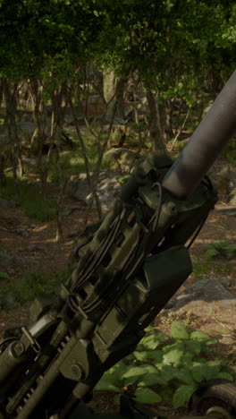 close-up of a military howitzer in a forest