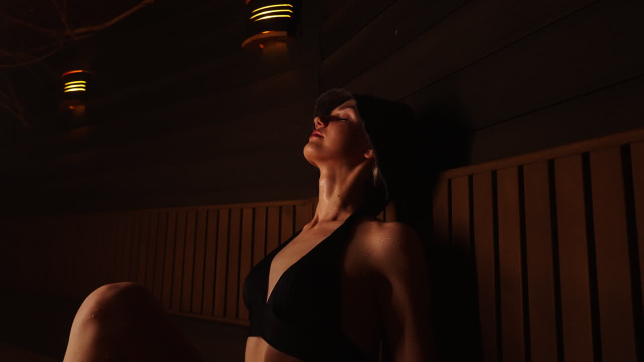 Woman relaxing in a Sauna