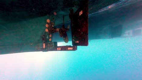 An-Up-close-Look-at-the-Boat's-Propeller-Submerged-in-the-Water-of-the-Red-Sea-in-Dahab,-Sinai-Peninsula,-Egypt---Underwater-Shot