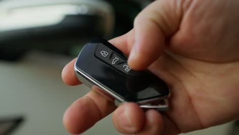 person holding a car key