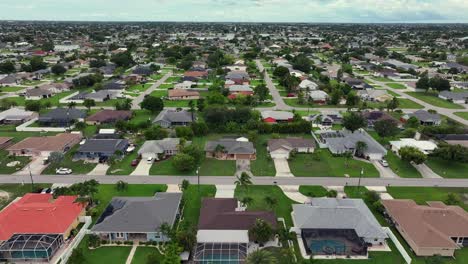 aerial view of a suburban neighborhood with houses and canals