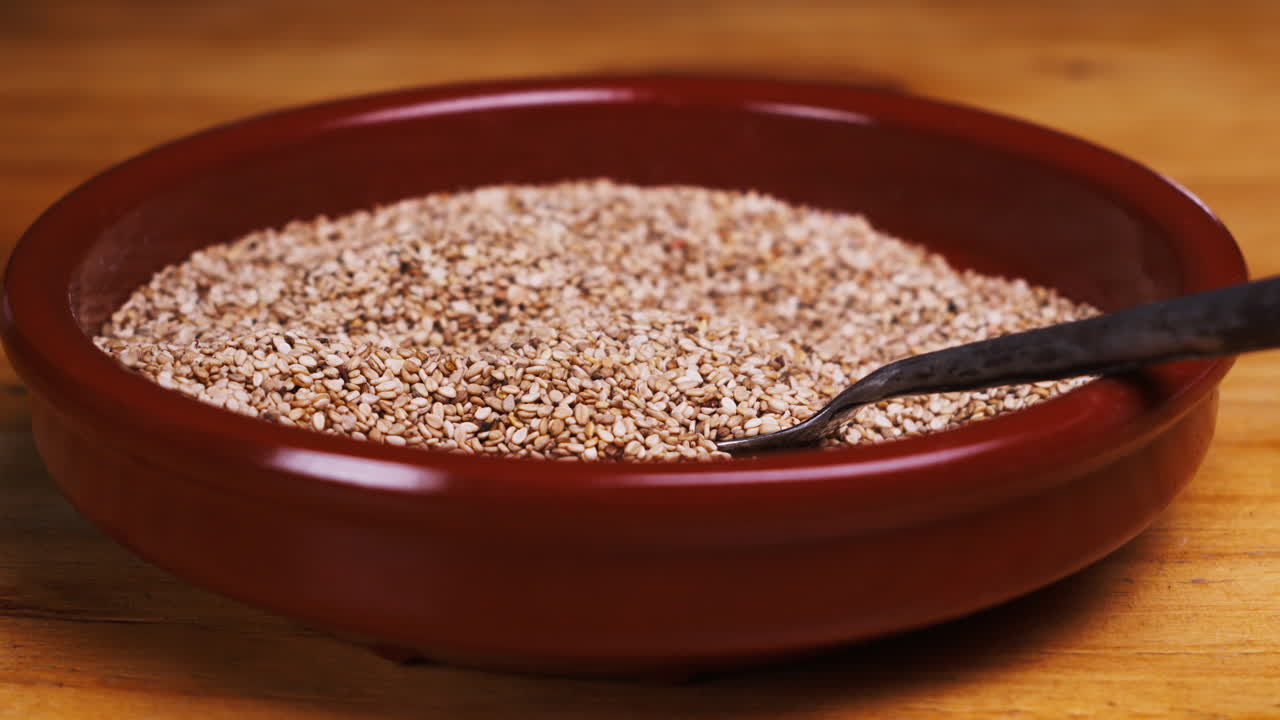 White dried sesame seeds close-up macro. Super food. Sprinkles for food.Healthy concept. High quality 4k footage